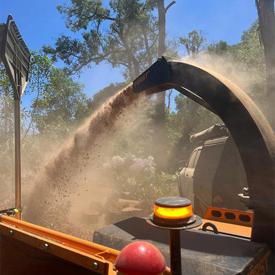 A woodchipper working to mulch up branches after a tree removal job in sunbury.